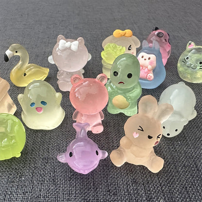 Lysende minidyrfigurer av harpiks i blindpose - 10 stk/sett